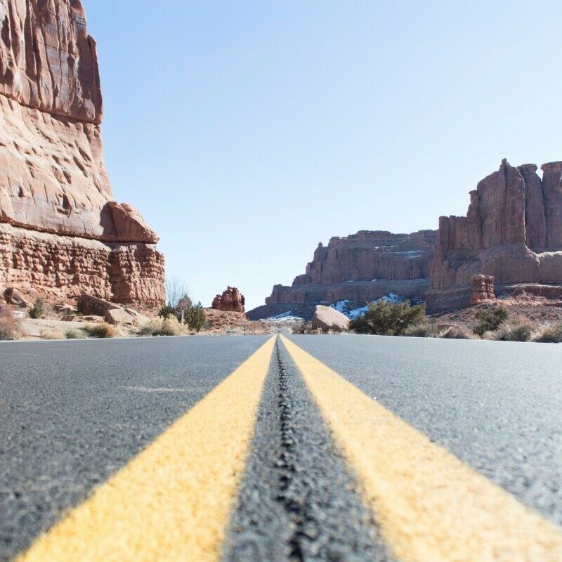 concrete pavement between rock formations